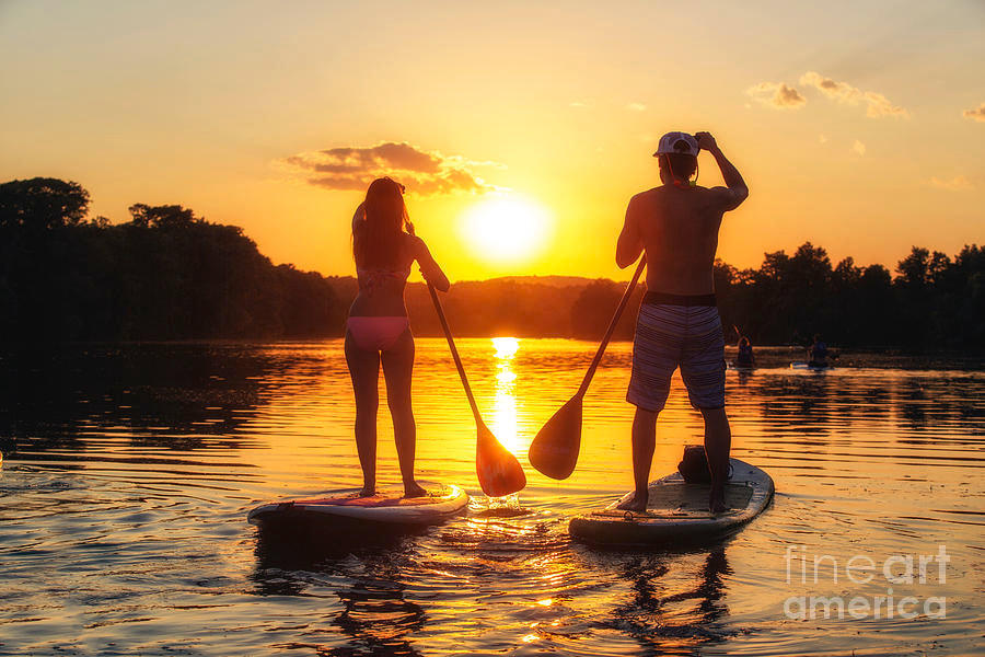 paddle boarding on the toronto islands at sunset in the summer with unforgettable views.